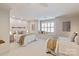 Bright and airy bedroom featuring two beds and a cozy window seat at 5917 Bridger Ct, Charlotte, NC 28211