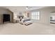 Large bedroom with soft carpet, a comfortable bed, and a bright window with shutters at 5917 Bridger Ct, Charlotte, NC 28211
