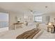 Expansive bedroom with multiple beds, soft carpet, and a cozy window seat at 5917 Bridger Ct, Charlotte, NC 28211