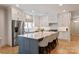 Stylish kitchen with an island, white cabinets, stainless steel appliances, and modern decor at 5917 Bridger Ct, Charlotte, NC 28211