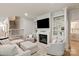 Comfortable living room with a fireplace and open staircase, perfect for relaxing at 5917 Bridger Ct, Charlotte, NC 28211