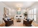 Elegant living room with neutral tones, decorative lighting, and comfortable seating at 5917 Bridger Ct, Charlotte, NC 28211