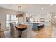 Open-concept living space flows into the dining and kitchen areas, perfect for entertaining at 5917 Bridger Ct, Charlotte, NC 28211