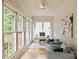 Bright home office with large windows, hardwood floors, and comfortable seating area at 5917 Bridger Ct, Charlotte, NC 28211