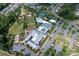 Aerial view showcases community amenities, featuring a pool, tennis courts, and green spaces at 602 Compass Dr, Denver, NC 28037
