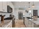 Modern kitchen featuring stainless steel appliances, granite counters, and white cabinetry at 602 Compass Dr, Denver, NC 28037
