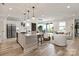 Spacious kitchen with a center island, modern appliances, and an open layout to the living area at 602 Compass Dr, Denver, NC 28037