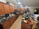 Functional kitchen with wooden cabinets, tile flooring and appliances at 6120 Brightstar Valley Rd, Mint Hill, NC 28227