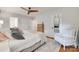 Bright bedroom featuring a ceiling fan, closet, and an accent chair, offering comfort and style at 6626 Rocky Falls Rd, Charlotte, NC 28211