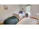 Charming bedroom with a single bed, a comfortable beanbag, and a window letting in natural light at 6626 Rocky Falls Rd, Charlotte, NC 28211