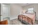 Comfortable bedroom featuring a cozy bed and natural light, offering a serene retreat at 6626 Rocky Falls Rd, Charlotte, NC 28211