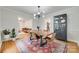 Elegant dining room with rustic table and seating, adjacent to the living room at 6626 Rocky Falls Rd, Charlotte, NC 28211