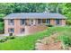 Charming brick home featuring a well-manicured lawn and inviting front entrance at 6626 Rocky Falls Rd, Charlotte, NC 28211
