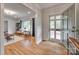 Inviting foyer with hardwood floors and large windows providing ample natural light at 6626 Rocky Falls Rd, Charlotte, NC 28211
