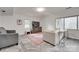 Cozy living room with comfortable seating, a mounted tv, and warm rug, creating a relaxing space at 6626 Rocky Falls Rd, Charlotte, NC 28211