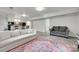 Cozy living room with comfortable seating and a vibrant rug, perfect for relaxing and entertaining at 6626 Rocky Falls Rd, Charlotte, NC 28211