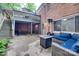 Back patio with outdoor seating, a patio heater, and stairs leading to an upper deck area with a table at 6626 Rocky Falls Rd, Charlotte, NC 28211