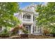 Charming two-story home with a covered front porch and manicured landscaping at 7043 Blakeney Greens Blvd, Charlotte, NC 28277