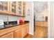 Kitchen features wooden cabinets, granite countertops, and a stainless steel sink at 7043 Blakeney Greens Blvd, Charlotte, NC 28277