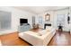 Bright living room with a fireplace, hardwood floors, and ample natural light at 7043 Blakeney Greens Blvd, Charlotte, NC 28277