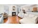 Inviting living room with a fireplace and hardwood floors at 7043 Blakeney Greens Blvd, Charlotte, NC 28277