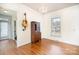 Bright, open room with a guitar on the wall at 7043 Blakeney Greens Blvd, Charlotte, NC 28277