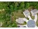 Aerial view of a home with a circular driveway and mature trees, showcasing its prime location at 7527 Finnigan Rd, Charlotte, NC 28215