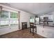 Modern dining area open to the kitchen with barstool seating and natural light at 7527 Finnigan Rd, Charlotte, NC 28215