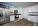 Functional kitchen with white cabinets, granite countertops, and stainless steel appliances at 7527 Finnigan Rd, Charlotte, NC 28215