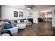 Spacious living room with a fireplace, ceiling fan, and stylish decor at 7527 Finnigan Rd, Charlotte, NC 28215