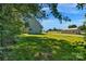 Expansive backyard and grassy yard perfect for Gathering activities with an outdoor storage shed at 7874 Lucky Creek Ln, Denver, NC 28037