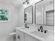 Elegant bathroom features double vanity, modern fixtures, and a large mirror at 7874 Lucky Creek Ln, Denver, NC 28037