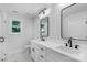 Elegant bathroom features double vanity, modern fixtures, and a large mirror at 7874 Lucky Creek Ln, Denver, NC 28037