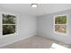 Neutral bedroom featuring large windows for plenty of natural light at 7874 Lucky Creek Ln, Denver, NC 28037