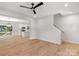 Open dining area with hardwood floors, a modern light fixture, a deck, and access to the kitchen at 7874 Lucky Creek Ln, Denver, NC 28037