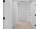 Neutral hallway featuring multiple doors for easy access at 7874 Lucky Creek Ln, Denver, NC 28037
