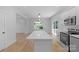 Bright, modern kitchen with a large center island and stainless steel appliances at 7874 Lucky Creek Ln, Denver, NC 28037