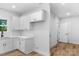 Modern kitchen featuring white cabinets, stainless steel appliances, and a sink with matte black faucet at 7874 Lucky Creek Ln, Denver, NC 28037