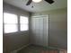 Cozy bedroom featuring plush carpet, natural light, closet and neutral walls at 809 Ruth Ave, Kannapolis, NC 28083