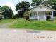 Charming one-story home with a well-manicured lawn and inviting front porch at 809 Ruth Ave, Kannapolis, NC 28083