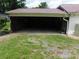 Spacious garage with concrete floor and natural lighting at 809 Ruth Ave, Kannapolis, NC 28083