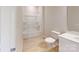 A bright bathroom features a vanity, toilet, and tub with shower at 8102 Jacey Ln # 24, Huntersville, NC 28078