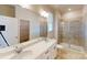 Bright bathroom featuring a double vanity, glass shower, and modern fixtures at 8102 Jacey Ln # 24, Huntersville, NC 28078