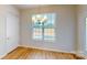 Bright dining area with modern chandelier, natural light, and door to exterior space at 8102 Jacey Ln # 24, Huntersville, NC 28078