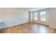 Spacious and bright living room with hardwood floors and large windows providing ample natural light at 8102 Jacey Ln # 24, Huntersville, NC 28078