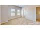 An airy bedroom with neutral carpet and two large windows at 8122 Jacey Ln # 19, Huntersville, NC 28078