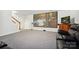 Finished basement featuring a large projector screen and home theater setup with comfortable black leather recliners at 8217 Lansford Rd, Charlotte, NC 28277