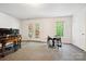 Finished basement with a drum set visible, with a walkout leading to a deck at 8217 Lansford Rd, Charlotte, NC 28277