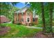 Charming brick home featuring a manicured lawn, black shutters, and a welcoming front entrance at 8217 Lansford Rd, Charlotte, NC 28277