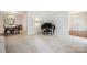 Open-concept living area with grand piano and seamless flow to dining space at 8217 Lansford Rd, Charlotte, NC 28277
